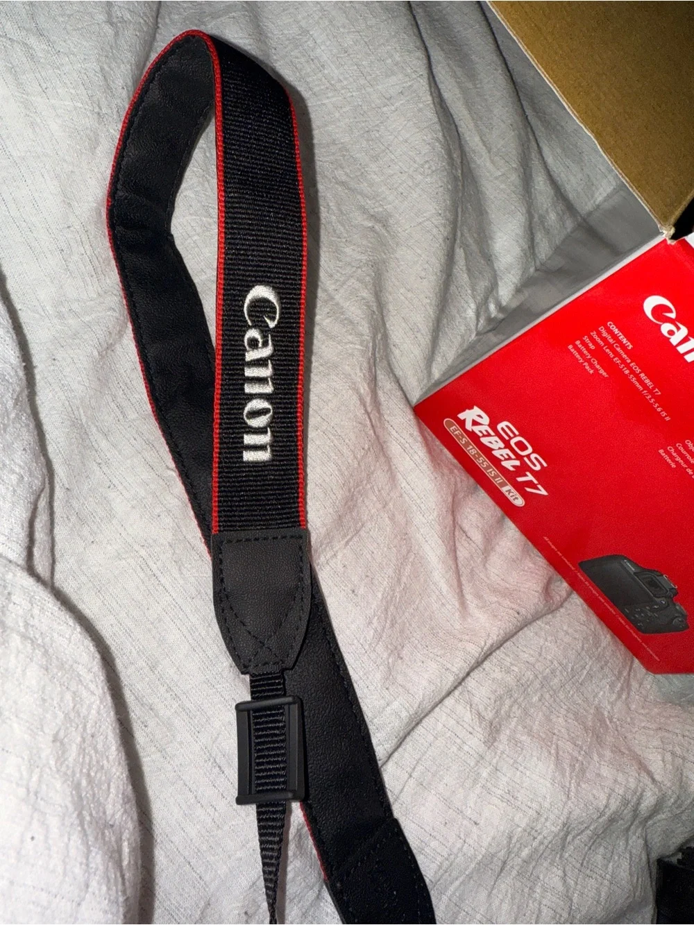 Canon DSLR Camera in Black with Red Strap Accent